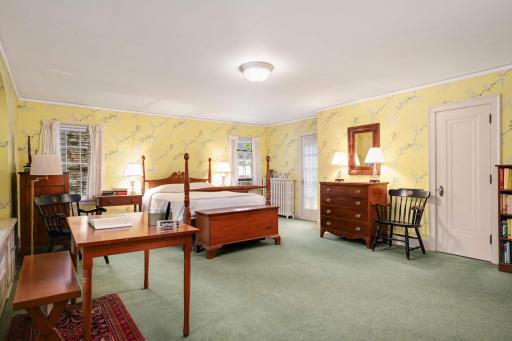 The vast primary site has 2 closets and a door to a balcony