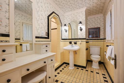 3/4 Primary bathroom with authentic tile and built-in vanity