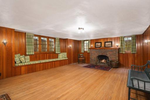 Lower Level Family Room has clear pine paneling and hardwood floors