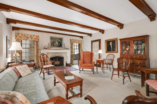 A classic wood burning fireplace is the focal point of the living room