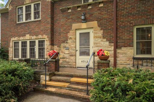 Brick and stone exterior and a front porch