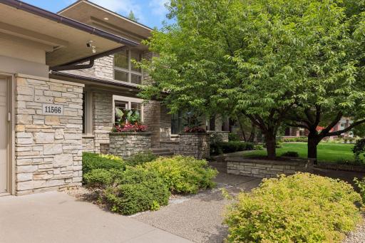The home's Prairie-style design provides oversized eaves, generous stone accents, stucco siding and beautiful copper gutters.