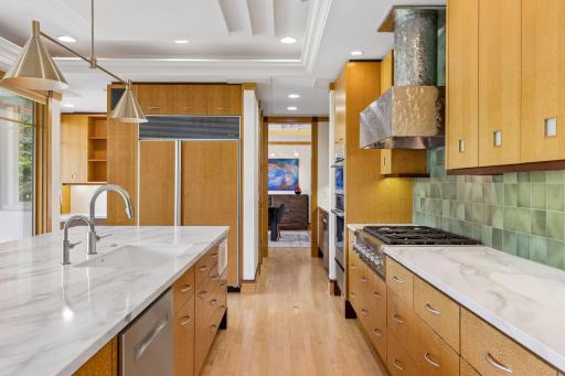 Looking towards the Butler's Pantry, the kitchen features a Bosch wall oven, and two microwaves.