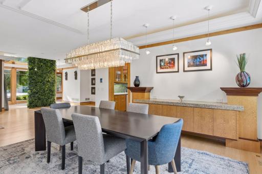 The formal dining room can seat a large group, and features an 8' built-in granite top dining buffet.