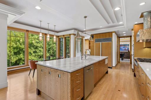 The kitchen's tray ceiling provides a subtle divide between this space and the adjoining living room.