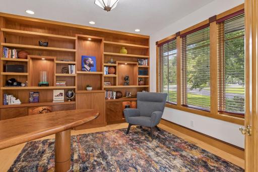 The main floor library/office overlooks the front yard, and features quality built-ins.