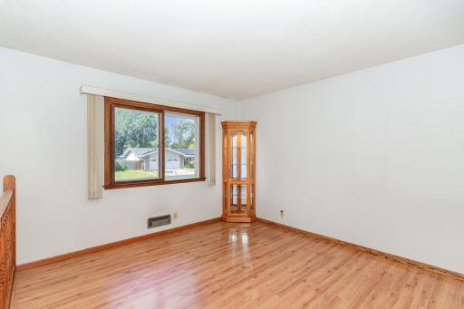 There is another corner light up cabinet in the living room area.