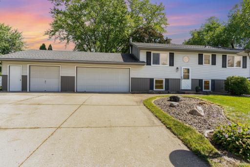 Nicely landscaped areas in the front, side and back yard around the tree.