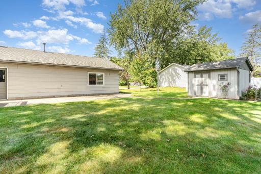 The large shed has gutters and a window and was used for all the lawn/snow equipment.