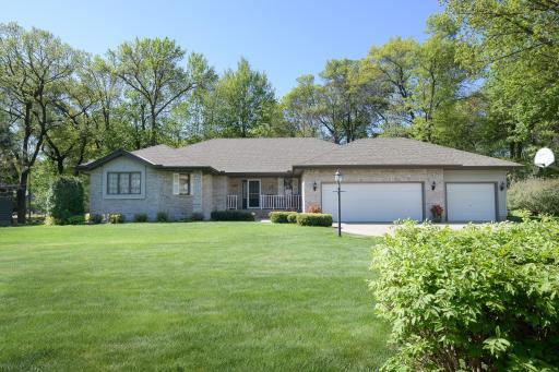 Brick & steel exterior, underground sprinkling & the most exquisite gardenscape in the area!