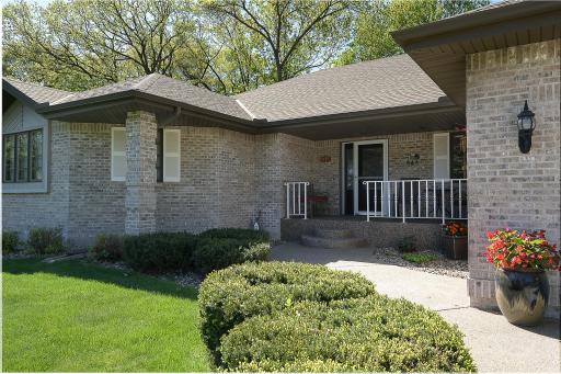 Some of the best curb appeal in the neighborhood with covered front porch & perennials