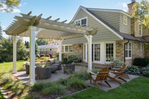 A charming exposed aggregate patio and pergola.