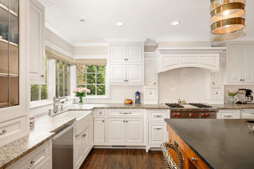 An abundance of enameled cabinets and top-of-the-line appliances,