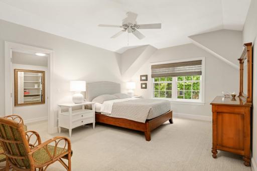 The primary suite is quite spacious and has high ceilings