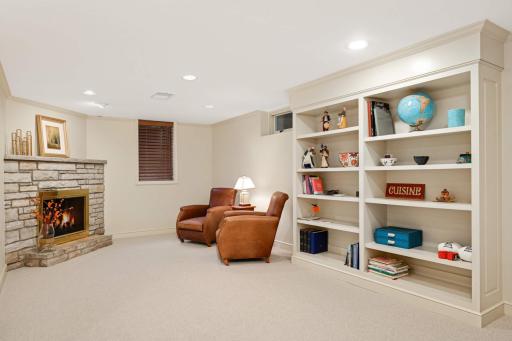 Original masonry fireplace bookcases and and egress window.