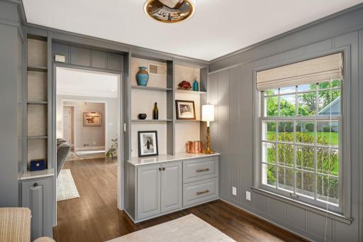 The Study has a wall of bookcases and windows on 3 sides