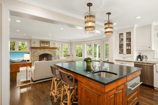 The large center Island has a second prep sink, a soapstone countertop, and dining space for five.