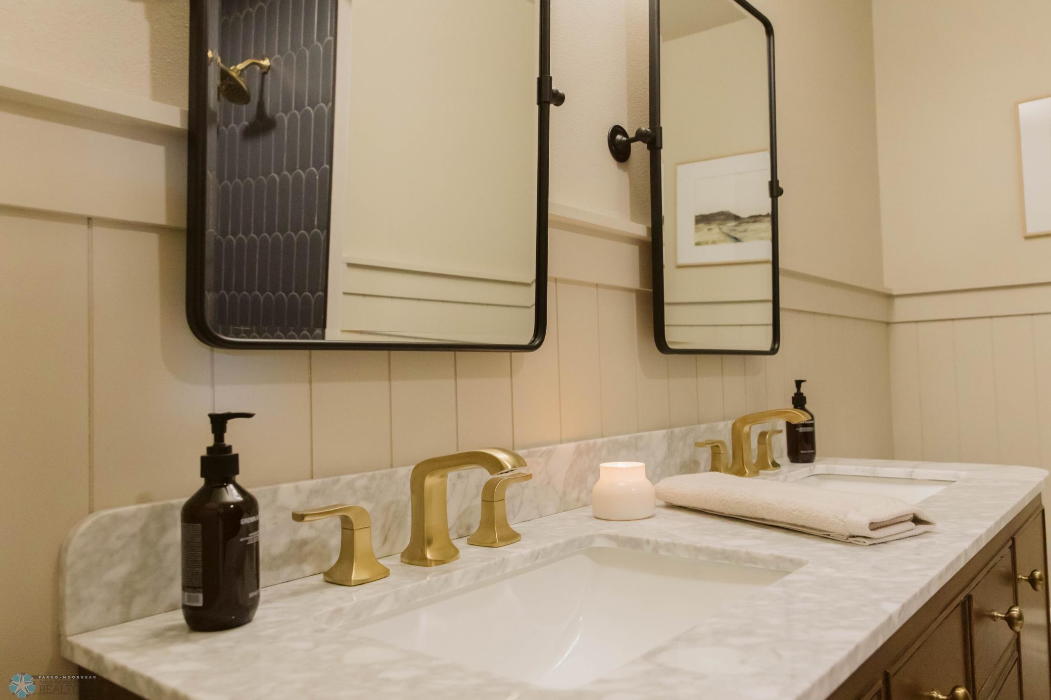 Updated Plumbing, Wainscoting, Mirrors & Fixtures Throughout