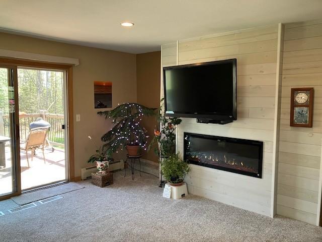 Newer accent wall with electric fireplace.