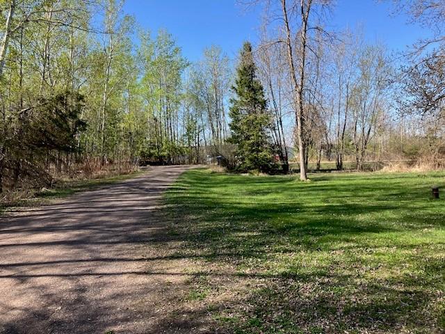 Driveway to the house and garage.