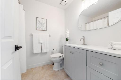 The full bathroom on the upper level also has a new vanity with ample counter and cabinet space.