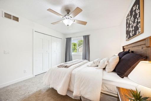 Ample closet space with updated closet doors.