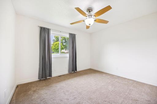 3rd bedroom on the upper level overlooking the backyard.
