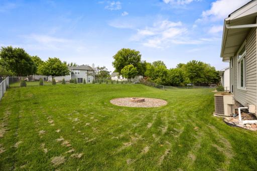 Looks at this beautiful large yard with fire pit and full fence.