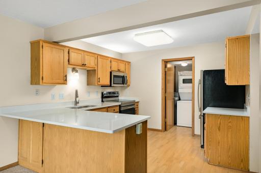 Dynamite sized kitchen offers newer stainless steel appliances and convenient snack bar seating at the counter.