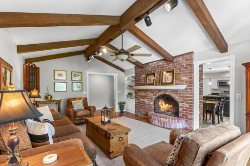 Charming brick fireplace with arched opening and custom mantle.