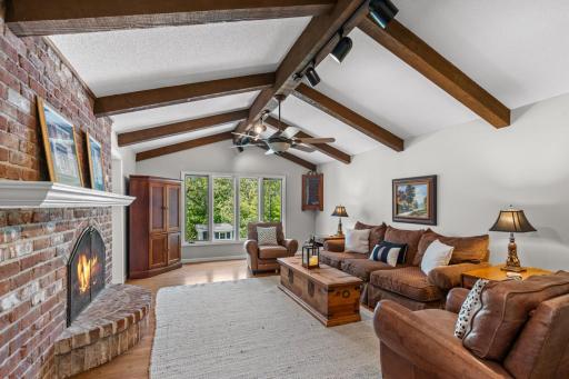 Warm and inviting living room with stunning exposed wood ceiling beams.