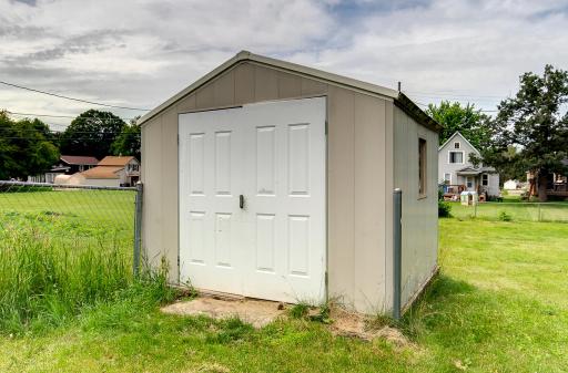 Convenient outside shed for all your storage needs.