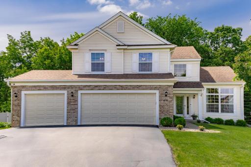 Stunning two-story home on private wooded lot in the heart of Eagan.