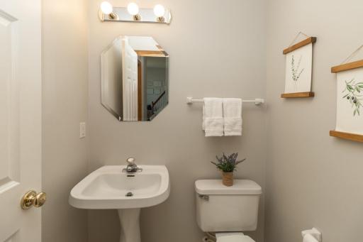 Main floor 1/2 bath conveniently located off kitchen.