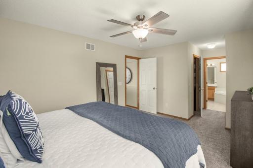 Primary suite features walk-in closet back left and a second closet on right.