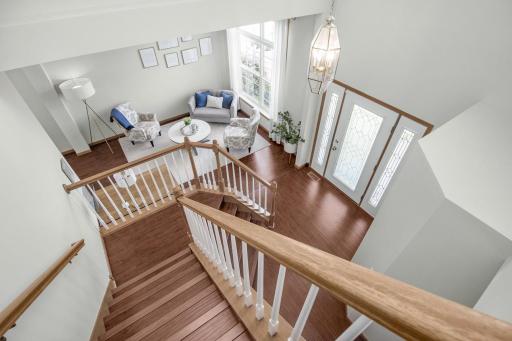 Handscraped laminate flooring throughout entry, formal living room, formal dining room, kitchen, family room, 1/2 bath and stairs.
