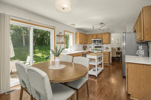 Informal dining area walks out to patio to extend living space.