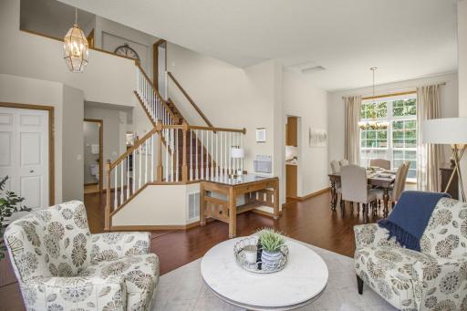 Experience the open floor plan from front entry through formal living room to dining room.
