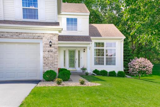 Inviting front entry with beautiful landscaping to welcome family and friends.