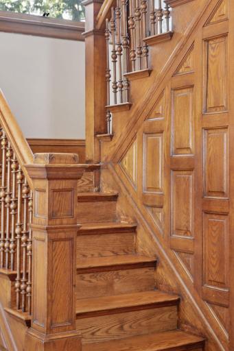 Spectacular turn of the century stairwell, spindles and wood paneling in prime condition