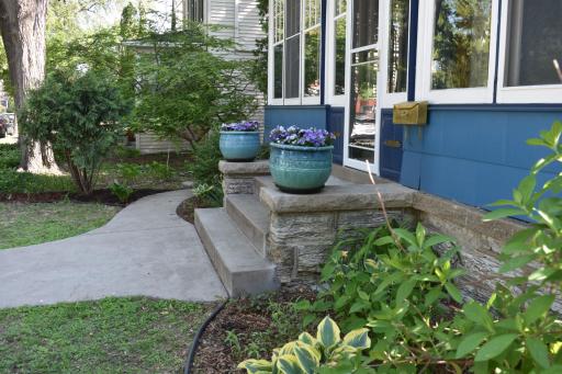 Lovely perennial gardens border the house