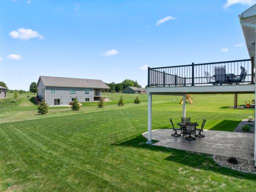 Backyard with views of upper deck and lower patio