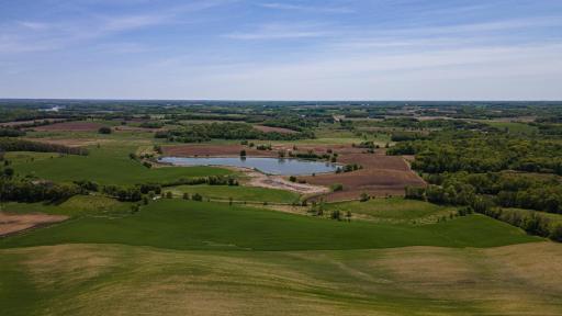 View of land to the south. Property line stops after green grass and before carriage road