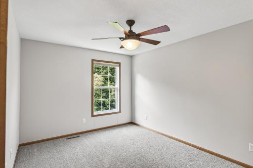 The third bedroom on the upper level. New carpet and fresh paint, truly move-in ready!