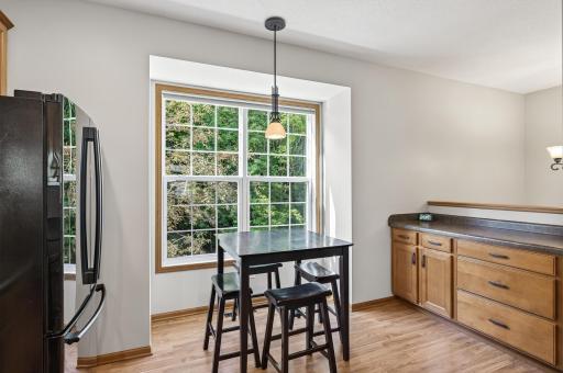 There is a buffet counter with additional cabinet and drawer space in the kitchen, this is a great location for a coffee bar. Just to the right of the counter you will find a built-in pantry perfect for storing snack and larger kitchen appliances.