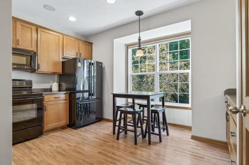 The large bump out window in the kitchen looks out to a wooded area and offers privacy that you don't usually find in a townhome community. It's also a great breakfast nook!