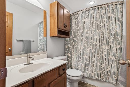 There is a full bathroom on the upper level that is shared by bedrooms 2 and 3. The vanity provides ample storage for all your bathroom essentials and the wall cabinet is great for your smaller items.