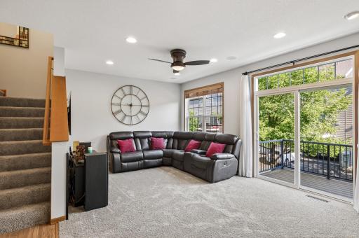 The living room is filled with natural light and walks out to the maintenance free deck. There is a generous amount of space that will easily fit all your furniture needs.