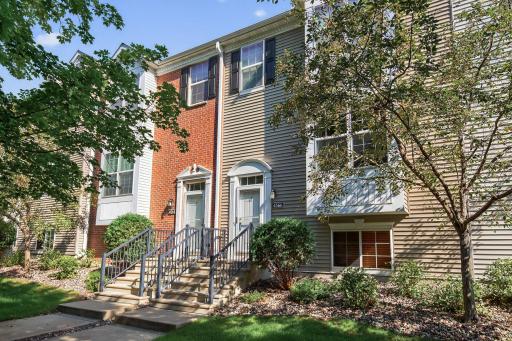 The front entry for 4566 Bulrush Blvd is the door on the right. There is guest parking just a few doors down the sidewalk and this door faces a wooded area which offers privacy not often found in townhomes.