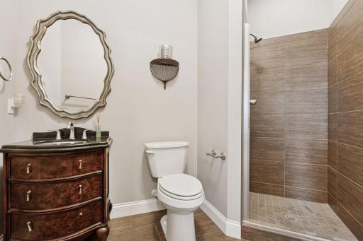 Main level 3/4 bath with tile floors and shower
